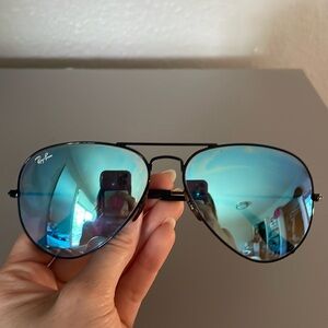 Ray Ban Aviators black rims with blue reflective lens